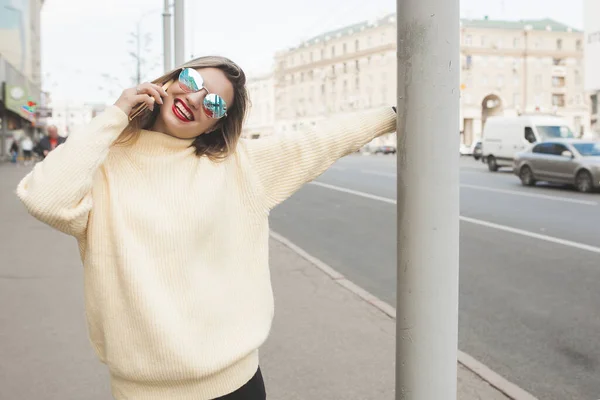 Attractive young woman on urban background.