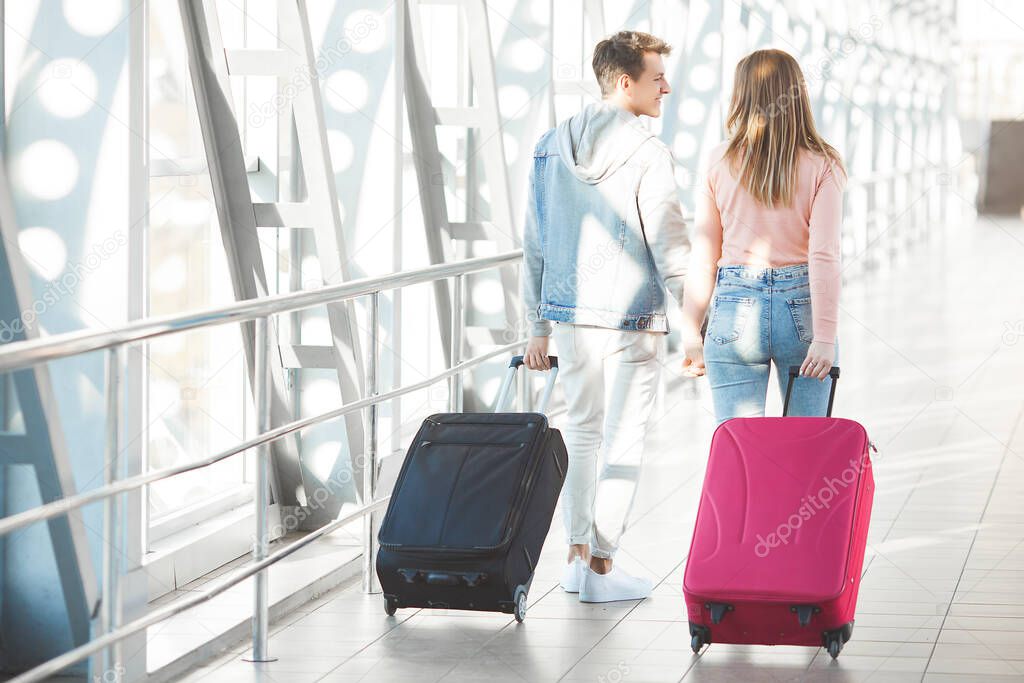 Young people traveling. Woman and man going on vacation.