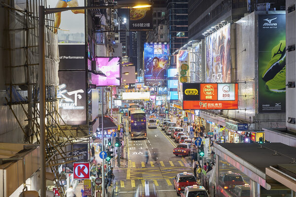 HONG KONG - SEPT 05, 2016: Mongkok at night in Hong Kong. Mongkok is characterized by a mixture of old and new multi-story buildings, with shops and restaurants at street level