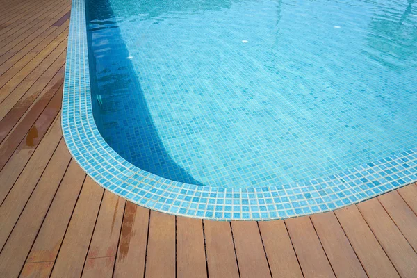 Swimming pool with fake wood flooring — Stock Photo, Image