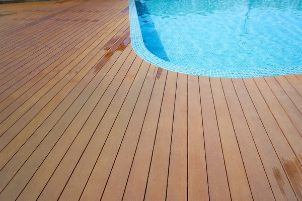 Swimming pool with fake wood flooring — Stock Photo, Image