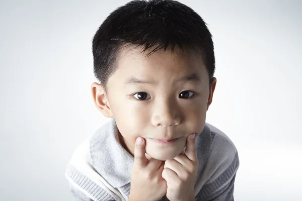 Little asian boy in studio Stock Picture