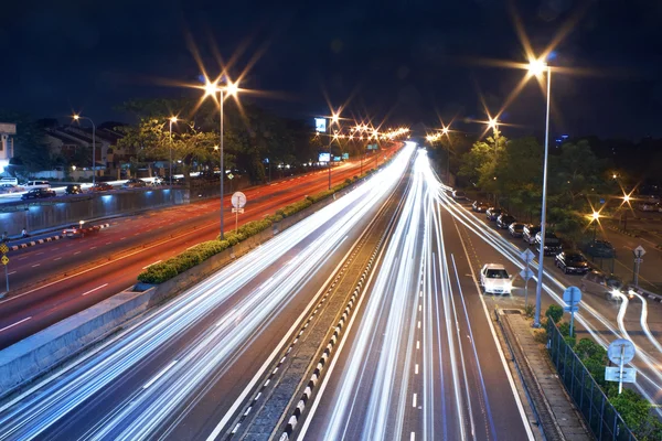 Traffic with blurred traces of cars Stock Photo