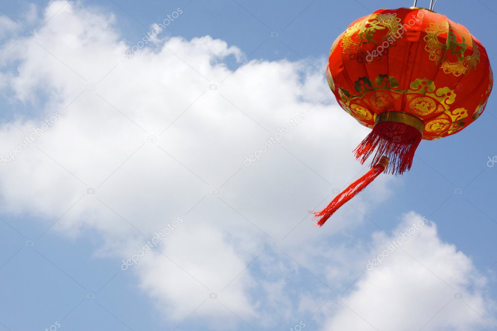 red Chinese lantern against blue sky