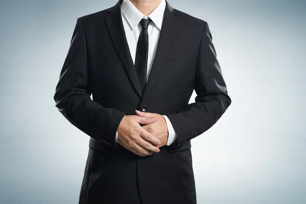 Affärsman i svart kostym — Stockfoto