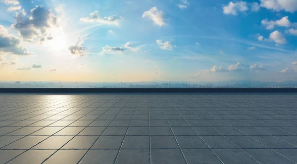 Empty concrete tiles floor with city background