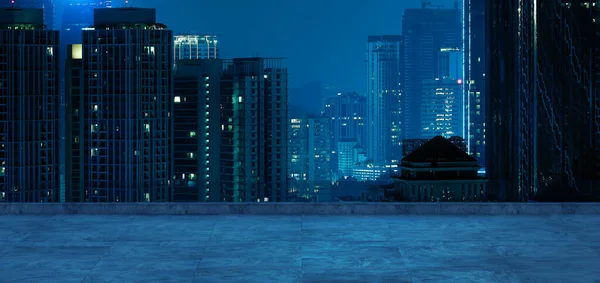 Panoramic view of empty concrete floor of rooftop with city skyline, Night scene
