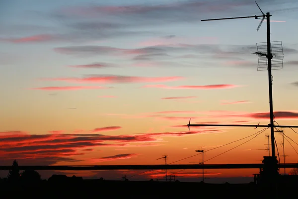 TV antennas at sunset