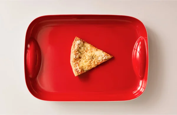 Play button made of pizza cut on red tray — Stock Photo, Image