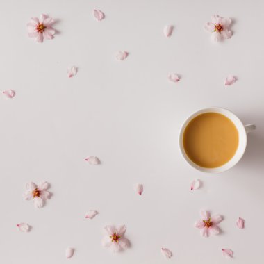 Morning coffee with flowers and petals. Flat lay. clipart