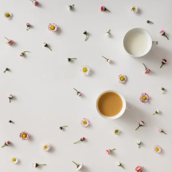 Creative colourful pattern made of flowers with coffee and milk. — Stock Photo, Image
