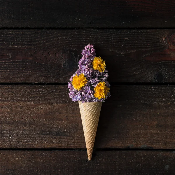 Ice cream cone with purple lilac — Stock Photo, Image