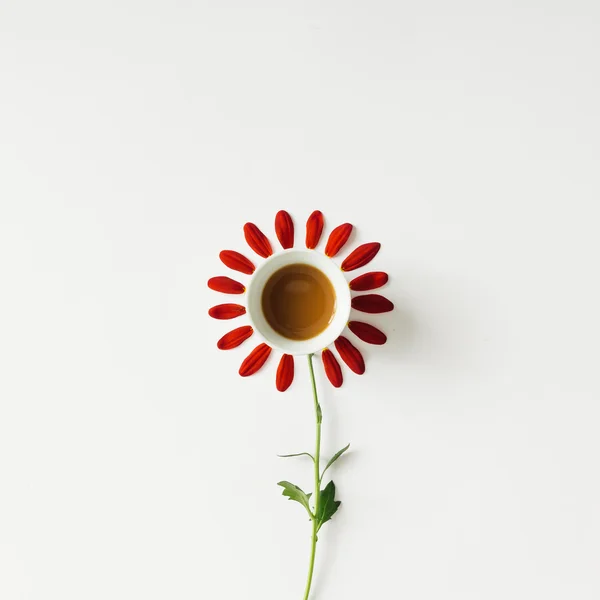 Coffee cup and flower petals.