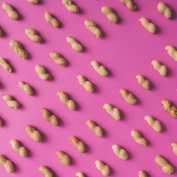 Erdnüsse Muster auf rosa Hintergrund — Stockfoto