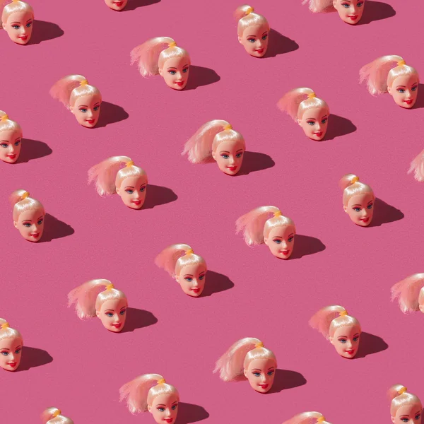 Pattern made of doll heads — Stock Photo, Image