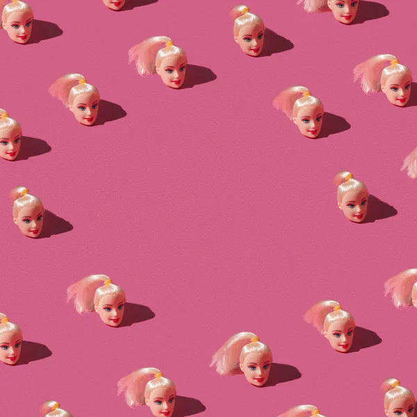 Pattern made of doll heads — Stock Photo, Image