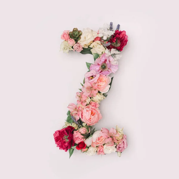 Letter Z made of real natural flowers and leaves. Flower font concept. Unique collection of letters and numbers. Spring, summer and valentines creative idea.