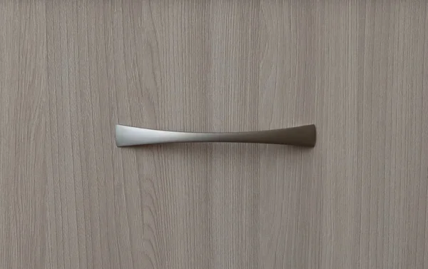 Wooden surface with metal handle. Manufacture of furniture for home and office.