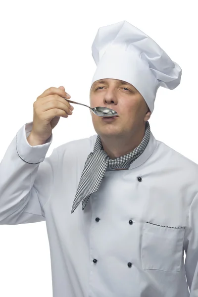 Szakács próbál étkezés egy kanál — Stock Fotó