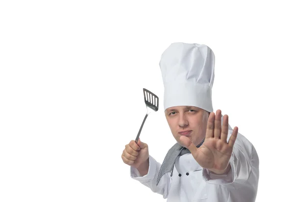 Chef sosteniendo una pala en su mano y está protegido — Foto de Stock
