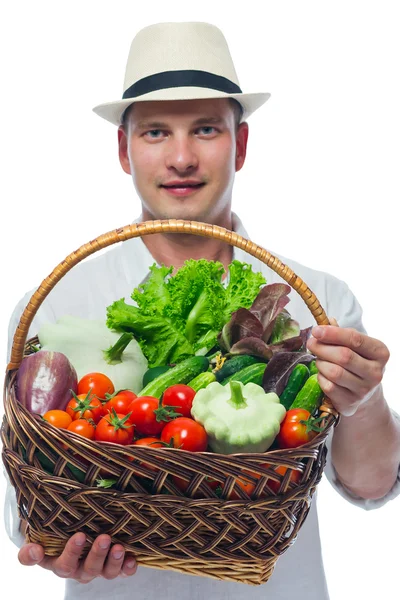 Basket of ripe vegetables at the farmer's hands — Stock Photo, Image