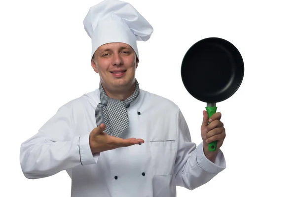 Arm chef toont op een koekenpan met een groene pen — Stockfoto