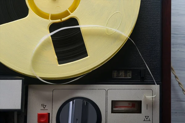 the tape on the reel of the magnetic tape recorder, close-up of buttons