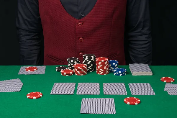 chips are on the green table, the cards are dealt, the start of the poker game