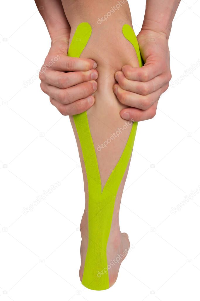 on a white background, a close-up of a leg with a taped tape, for recovery from a sports injury, and two hands clasping the calf part