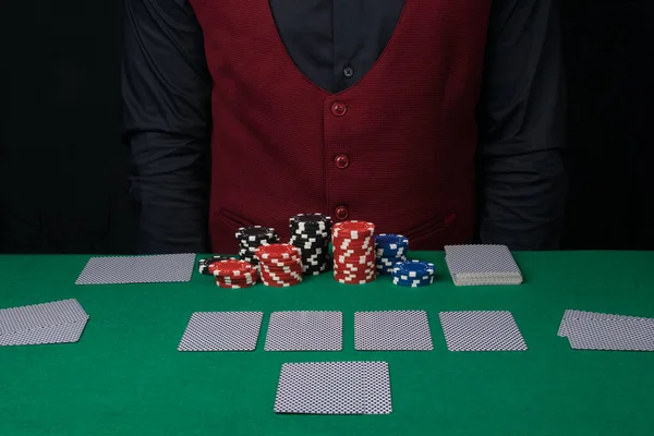 closed card backs, laid out by the dealer, for poker players