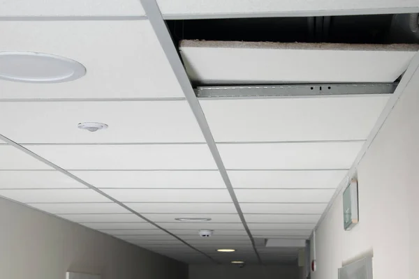 white false ceiling with open hole