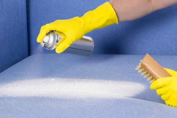 dry cleaning of upholstered furniture with a spray of cleaning foam