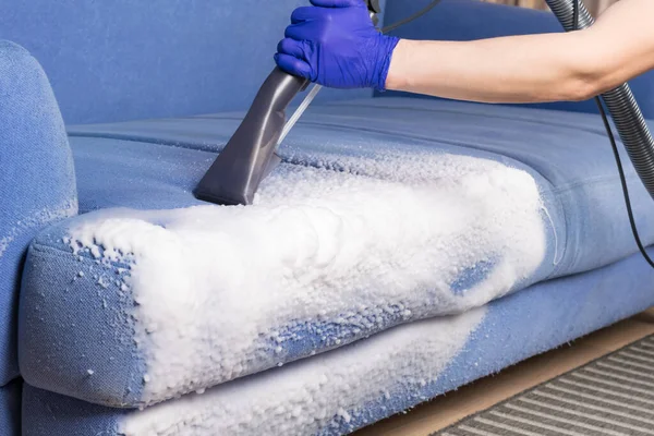 the vacuum cleaner collects foam for dry cleaning of upholstered furniture