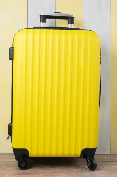 Large Yellow Travel Suitcase Stands Front Gray Background — Stock Photo, Image