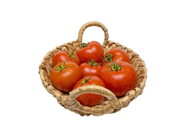 Tomates frescos en una canasta sobre un fondo blanco — Foto de Stock