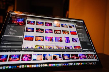 Valmiera, Latvia - October 4, 2025 - A close-up view of a laptop screen displaying Adobe Lightroom with vibrant event photos being edited. Various image thumbnails and settings are visible.