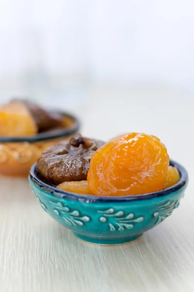 Dried apricots and figs on a plate — Stock Photo, Image