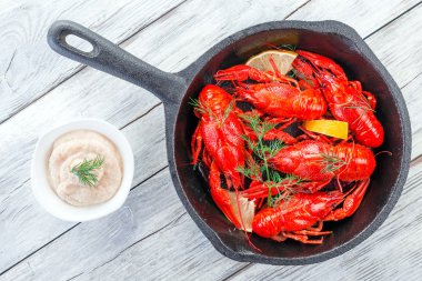 crawfish on a frying pan,  view from above clipart