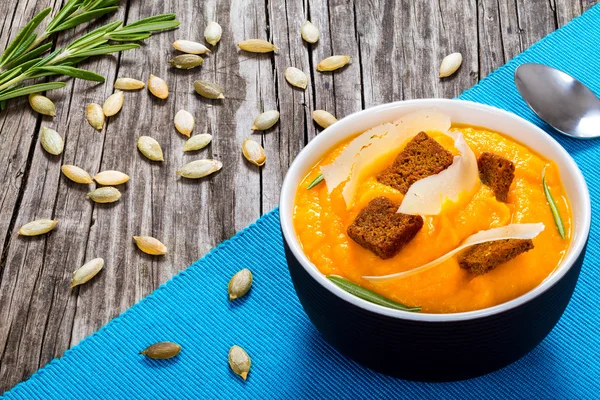 Pumpkin creamy soup with parmesan cheese, view from above — Stock Image Pumpkin creamy soup with parmesan cheese, view from above Stock Image