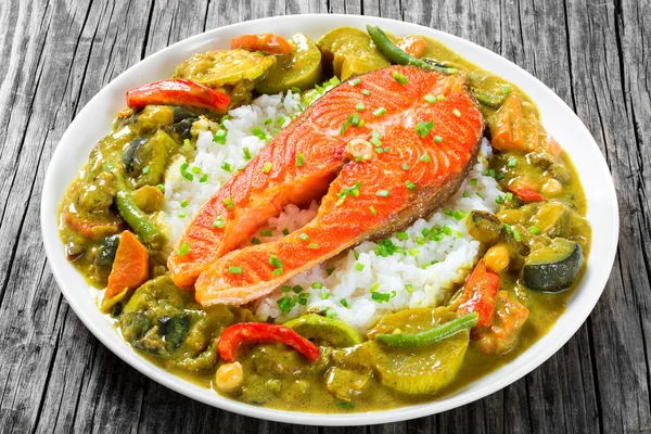 Fried steak of red fish with rice and homemade curry — Stock Image Fried steak of red fish with rice and homemade curry Royalty Free Stock Photos