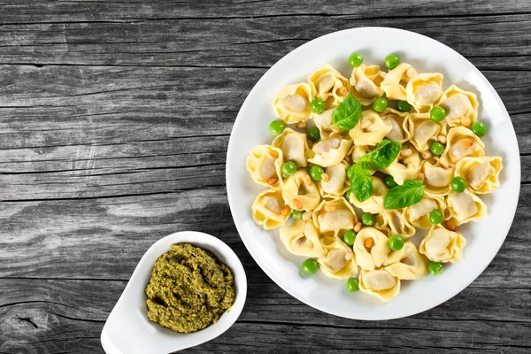 Tortellini with green peas, fried Pine nuts,  top view — Φωτογραφία Αρχείου