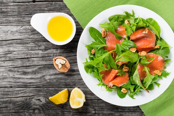 Red fish healty salad on white dish — Stockfoto