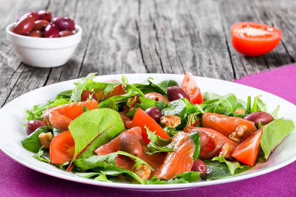Red fish healty salad on white dish — Stok fotoğraf