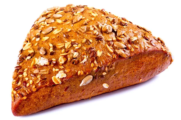 Organic rye bun on a white background, close-up — Stock Image Organic rye bun on a white background, close-up Royalty Free Stock Photos