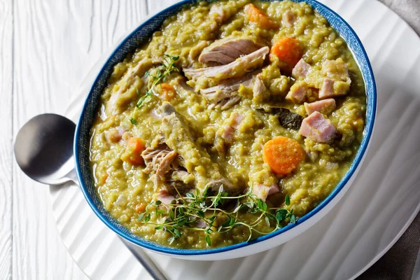 Close-up of green peas finnish soup with pork ribs and ham in a bowl, horizontal view from above — Stock Image Close Green Peas Finnish Soup Pork Ribs Ham Bowl Horizontal Royalty Free Stock Images