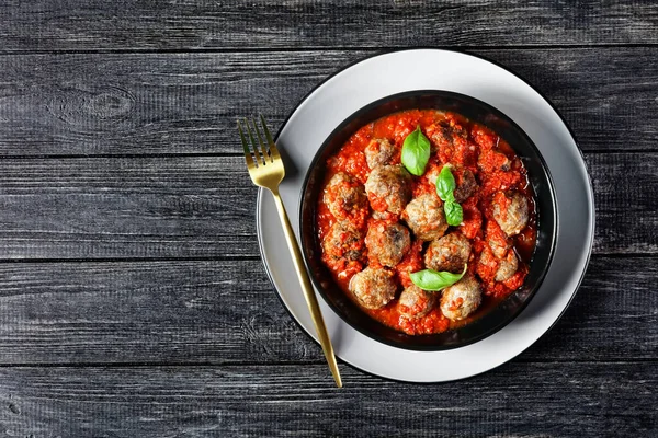 Italian Dish Meatballs Baked Marinara Sauce Served Black Plate Fork — Stock Photo, Image