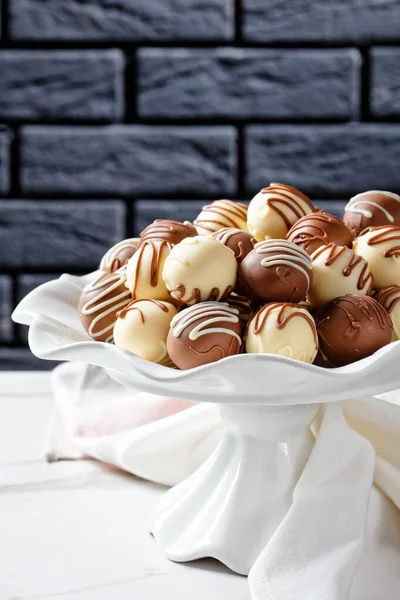Chocolate truffles balls on a cake stand