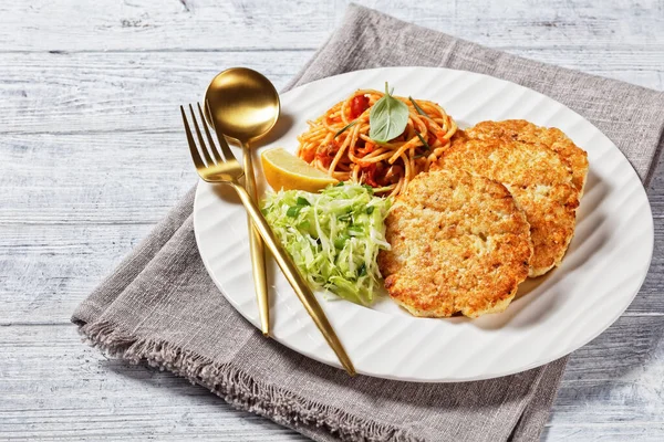 Baked Cod Fish Patties Served White Plate Coleslaw Spaghetti Mixed — Stock Photo, Image