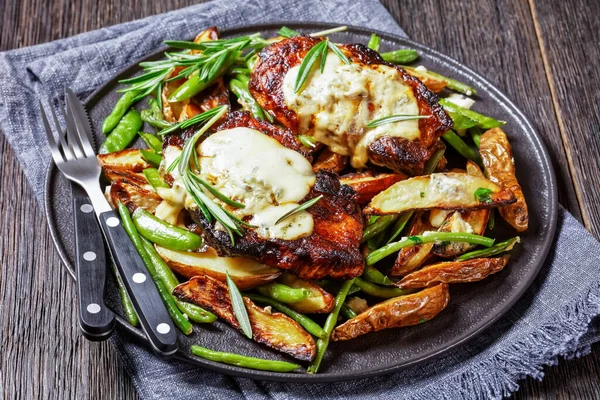 Close Pork Sreaks Topped Melted Blue Cheese Rosemary Pad Roasted — Stock Photo, Image