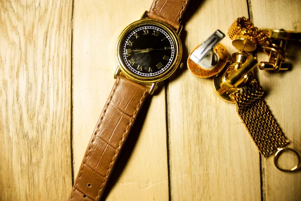 Luxurious chrome watch with other pieces of jewelry — Stock Photo, Image